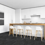 Corner of modern kitchen with white walls, concrete floor, white cupboards and bar with stools. Two built in stoves. 3d rendering